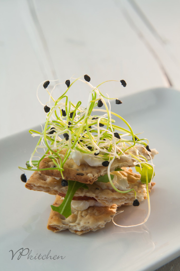 cracker with arugula and sprouts